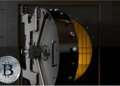 Porta de cofre aberta com iluminação dourada e moeda de Bitcoin prateada na frente, simbolizando segurança e proteção de patrimônio digital