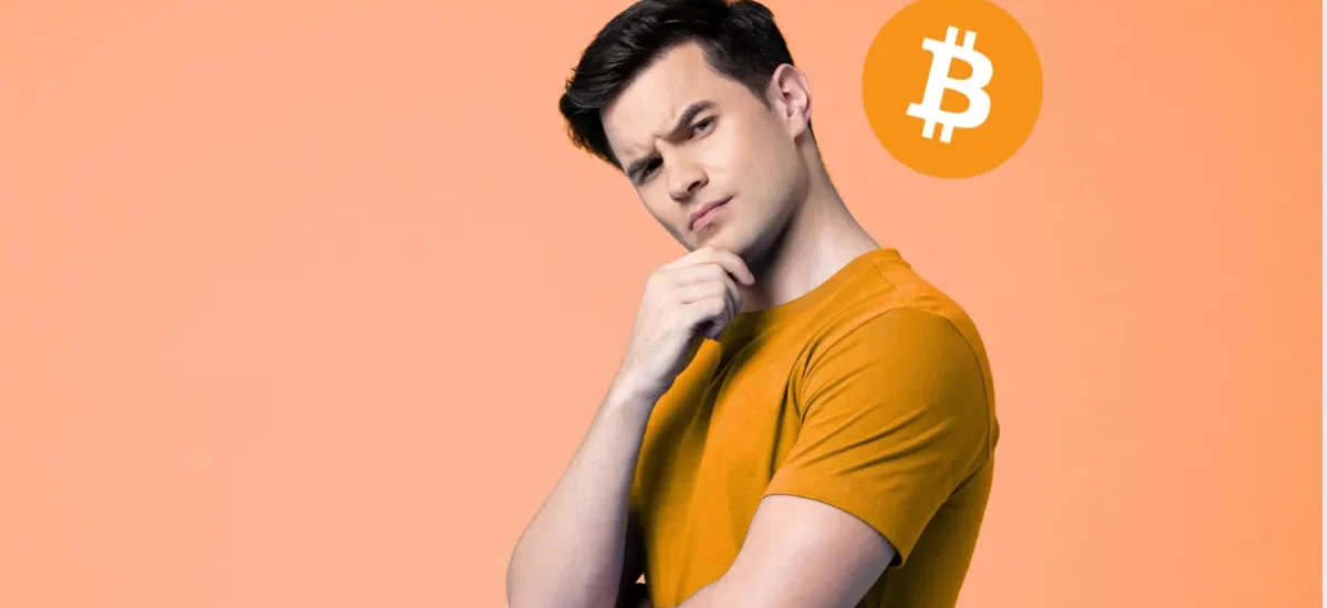 Man thinking with Bitcoin logo — illustrating covered calls and wheel strategy for BTC income