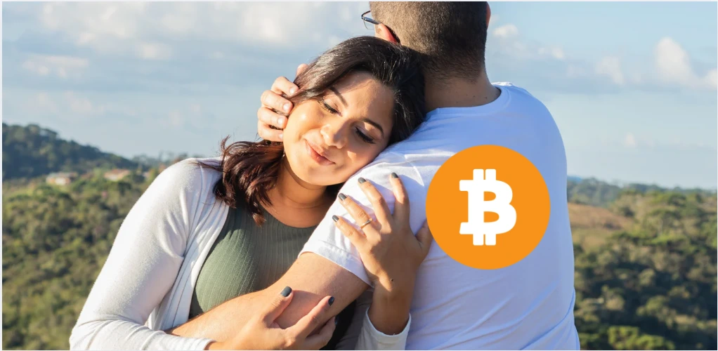 Casal se abraçando em ambiente natural simbolizando segurança, continuidade e herança patrimonial com Bitcoin e criptoativos no longo prazo