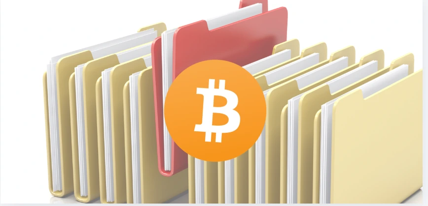 Pastas organizadas representando documentação segura de acesso a Bitcoin e criptoativos no planejamento sucessório