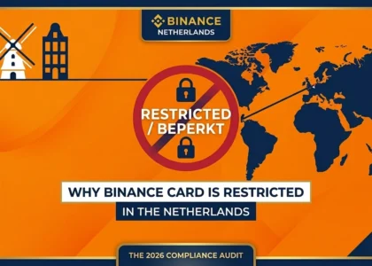 rofessional 1000x600 hero banner for DamaDeFi. Features a vibrant Dutch orange background with a world map and a prominent red restriction symbol. The text reads 'WHY BINANCE CARD IS RESTRICTED IN THE NETHERLANDS - THE 2026 COMPLIANCE AUDIT' on clean white and blue bars. Stylized icons of a windmill and Amsterdam houses are visible in the corner.